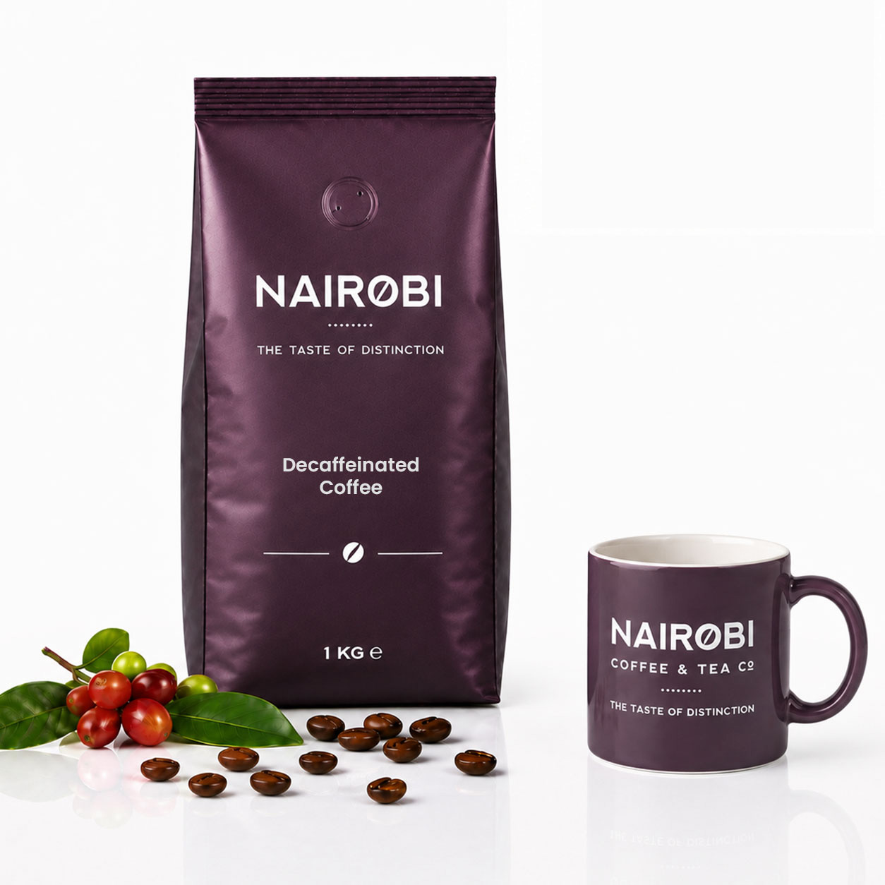 Nairobi Coffee Decaf Blend 1kg decaffeinated coffee beans beside a blue and gold coffee cup, roasted beans and coffee cherries
